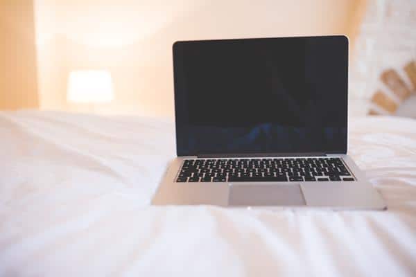 laptop on the bed